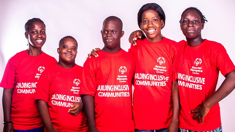 A group of Special Olympics Gambia athletes pose together.