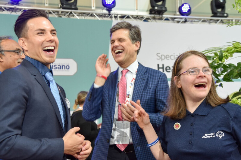 Special Olympics International Board of Director Chair Timothy Shriver, Special Olympics Global Ambassador Apolo Ohno and Special Olympics Sargent Shriver International Global Messenger Hanna Joy Atkinson laughing.