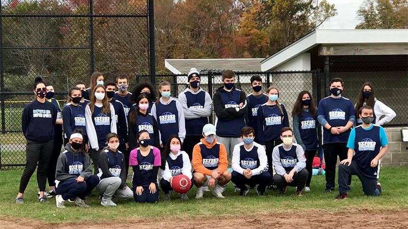 Coach LaCapra poses with students from her Unified P.E. class.