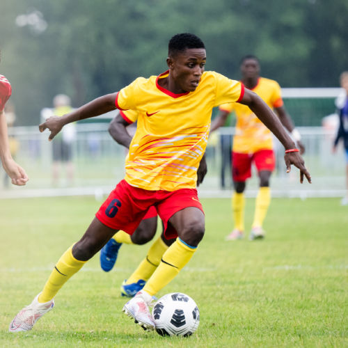 A soccer player dribbling the ball