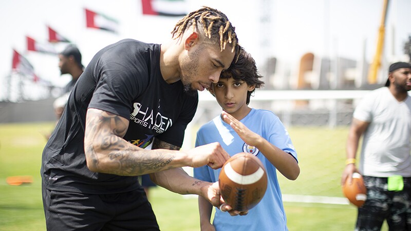 Joe Haden coaches athletes during the unified flag football at Zayed Sports City during the Special Olympics World Games in Abu Dhabi on March 16, 2019.