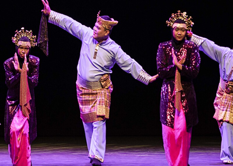 Dancers on stage performing.