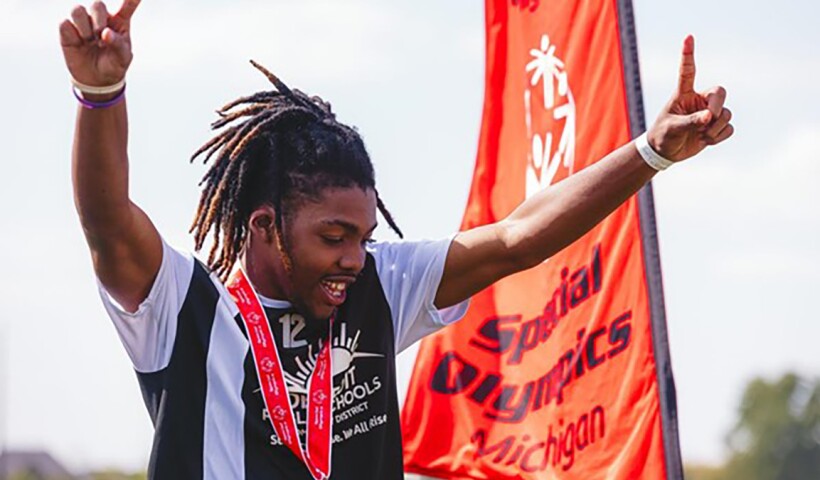 Player has his arms up in celebration. 