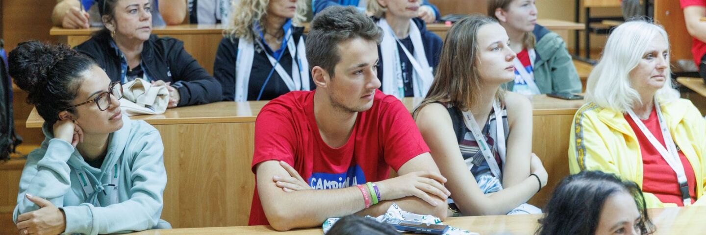 A group of people sat at desks