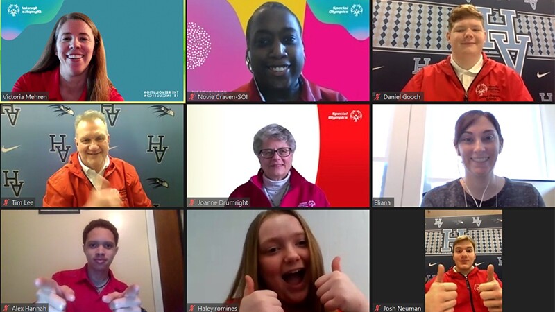 A group of Special Olympics athletes and supporters appear on a Zoom screen. 