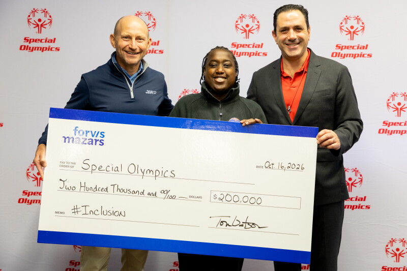 Three people holding a large-size check. 