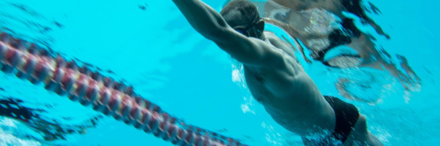 Athlete swimming under water.