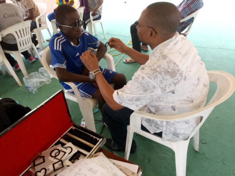 Malachie receiving an eye examination