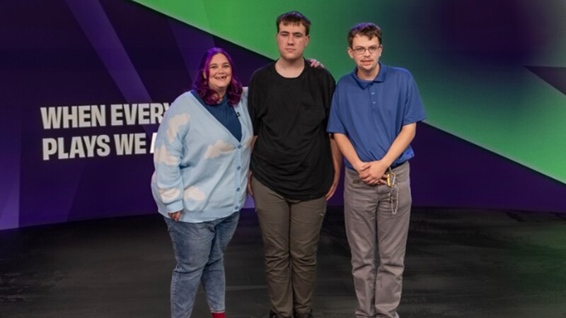 Three young men standing next to each other