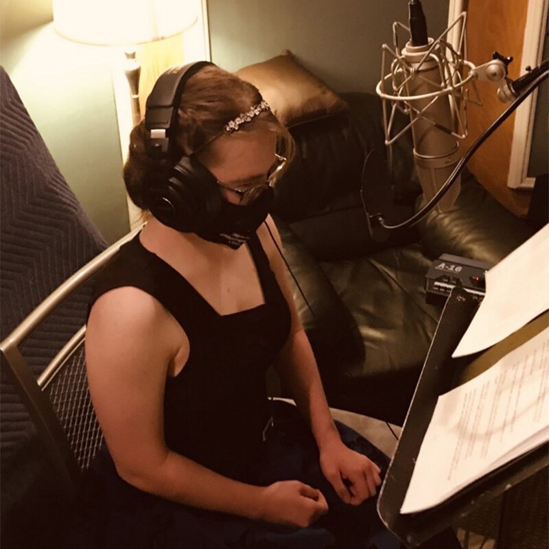 Hanna Joy Atkinson in a soundbooth.