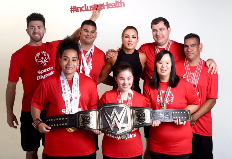 School of Strength Athletes pose with WWE Superstar Becky Lynch 