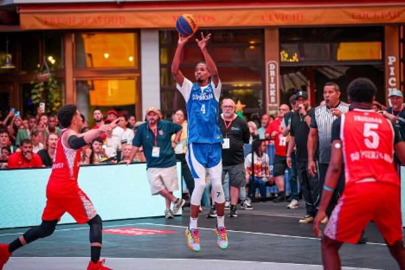 A player jumps into the air as his opponents race towards him