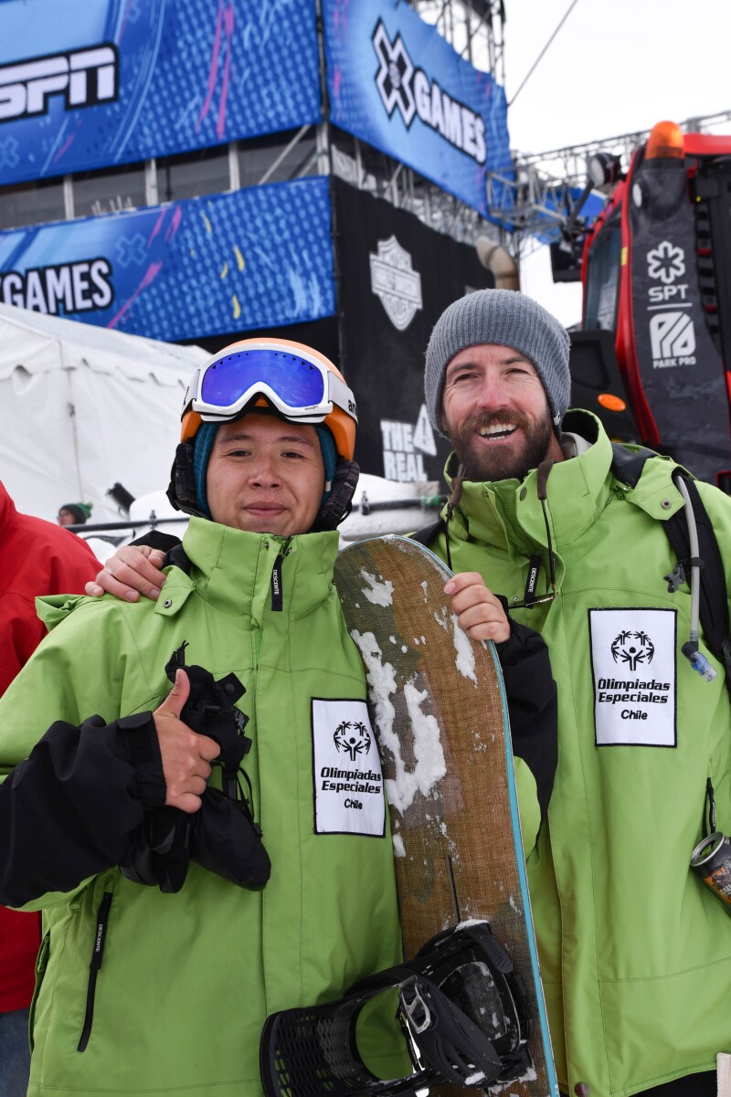 Silver medalist Juan Guentrutripai with his coach giving a thumbs up.