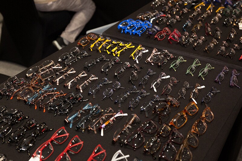 A tray table full of glasses in all styles and sizes.