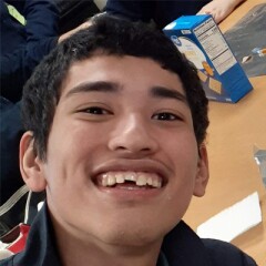 Cristian Salvador-Campos smiling for a selfie.