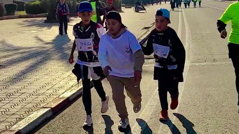 Special Olympics Morocco students offer encouragement as they run together 