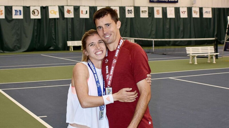 Brittany hugging her fiance Ryan on the tennis court
