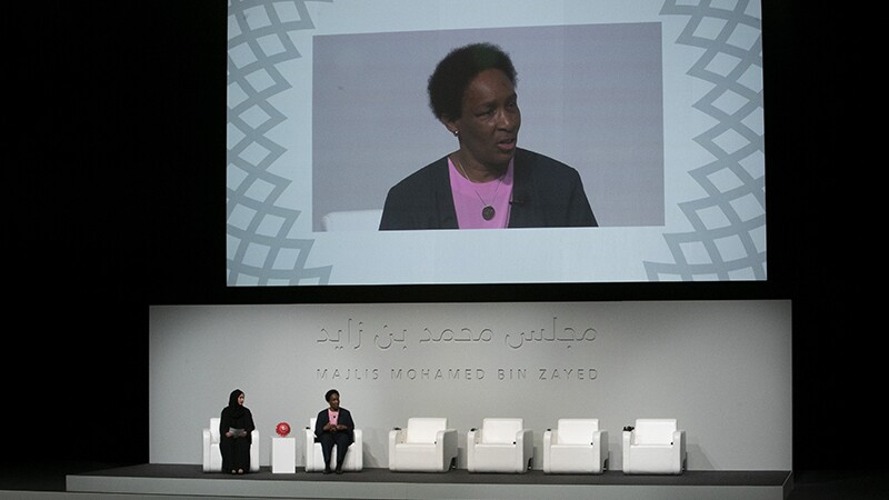 Loretta on stage speaking