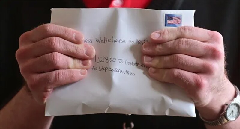Steven holding an letter he sent to the White House.