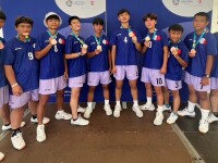 Group of young men showing their medals off. 