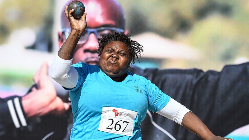 Woman throws shotput