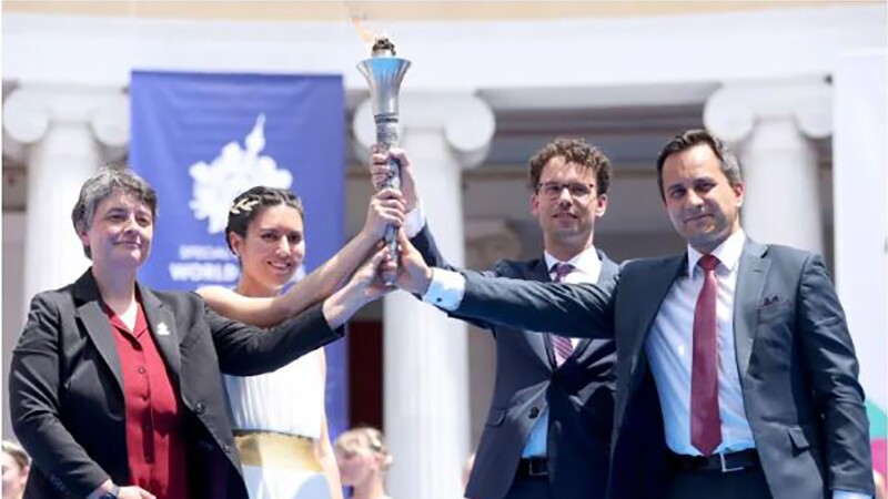 Group of people holding the flame of hope. 
