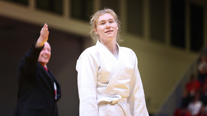 Judo athletes smiles towards fans