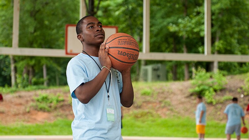 An athlete practices their basketball skills.