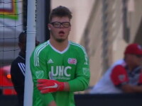 Goal keeper on the field in the goal box. 