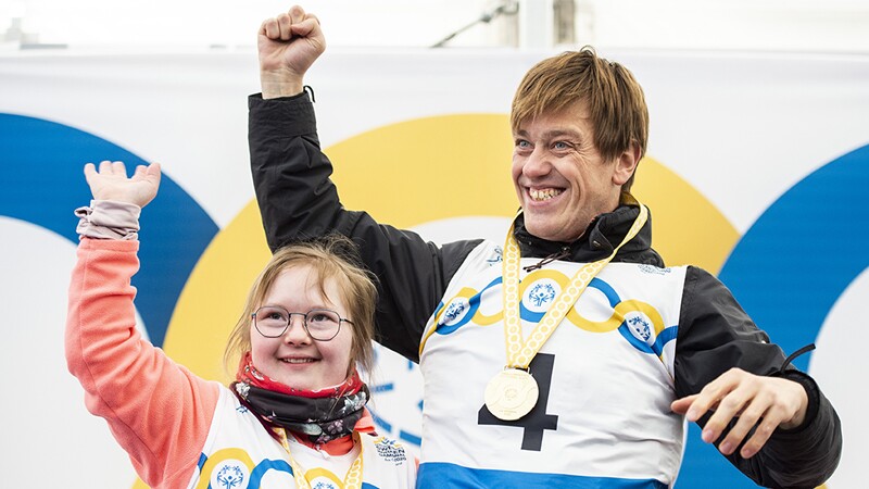 Sofia Storling and Cyril Lamalle celebrate at the medal ceremony for the Alpine Skiing competition.