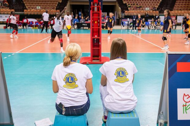 Two people sat with their backs to camera