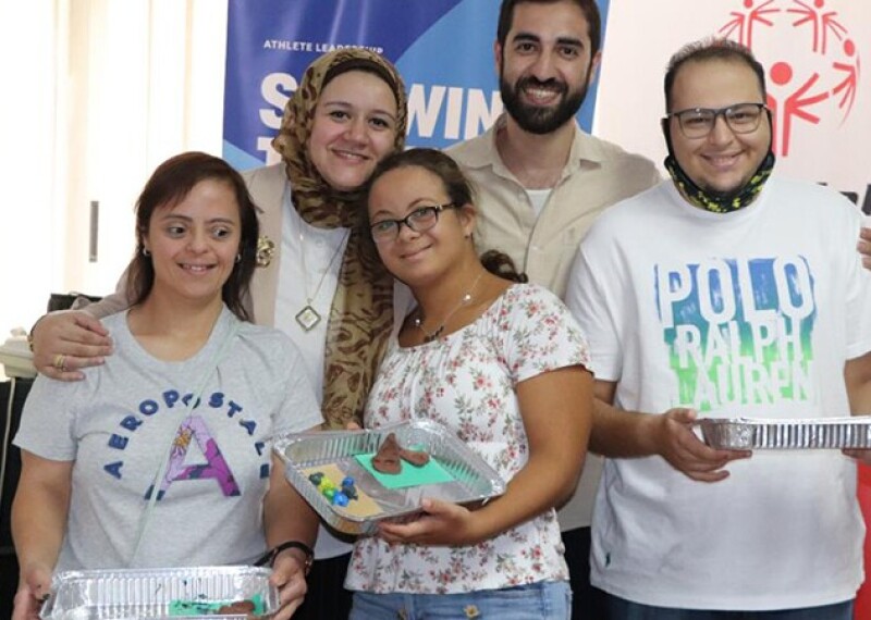 Members of the Youth Leaders Council, including Omnia (top left) and Sherif (far right), pose together after an activity.