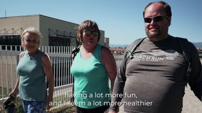 Three people walking outside