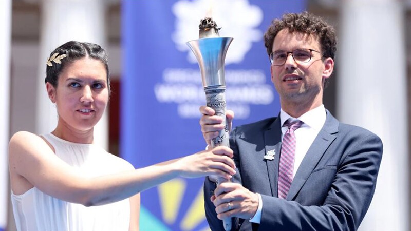 Two people holding the flame of hope. 