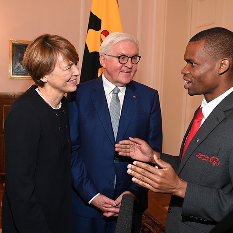 Three people talking