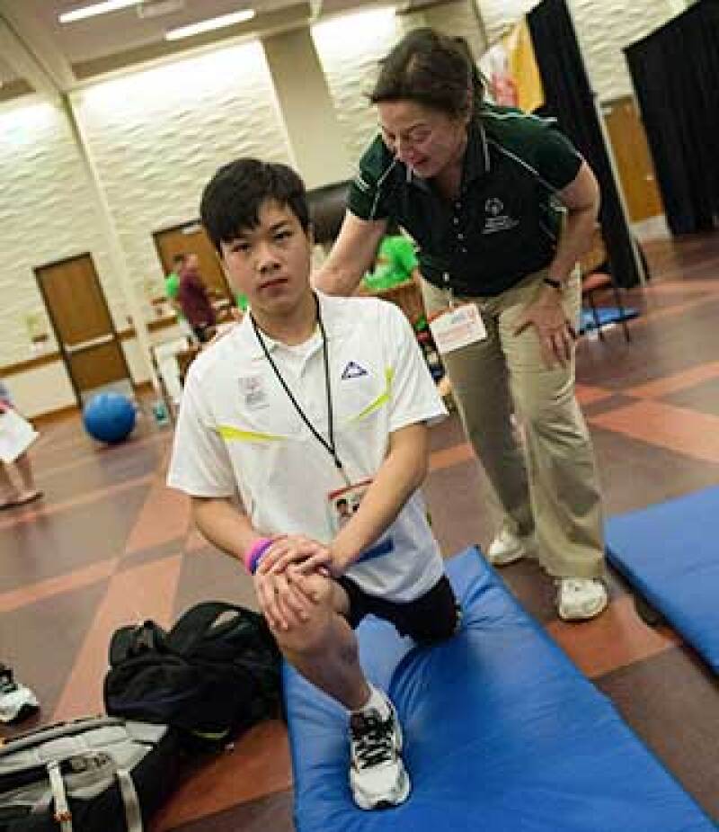 Special Olympics Hong Kong swimmer Ka Hun Chui has his flexibility measured at a health screening clinic.