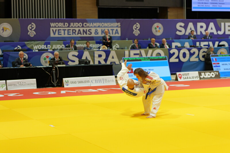 Two judokas performing kata on the tatami 