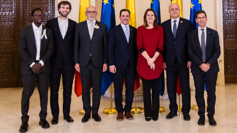 A group of people standing side by side. 