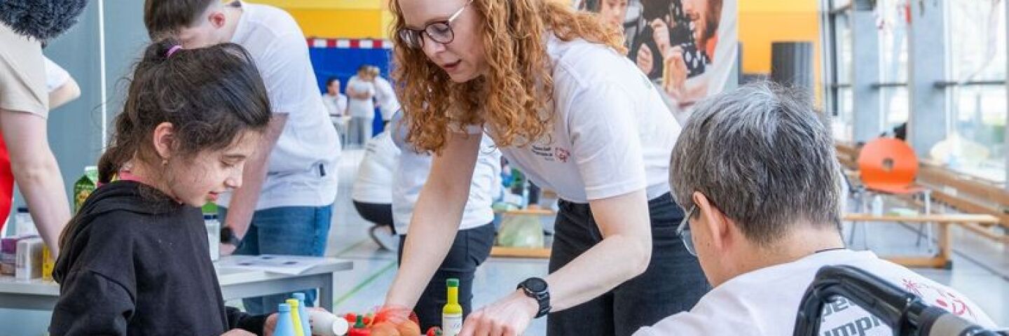 A lady helping a child