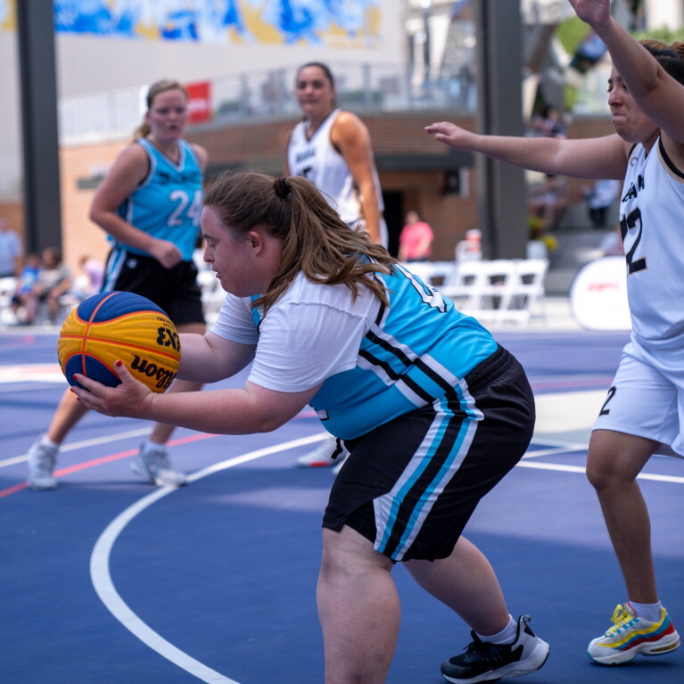 Young woman receives the ball and prepares for her next move. 