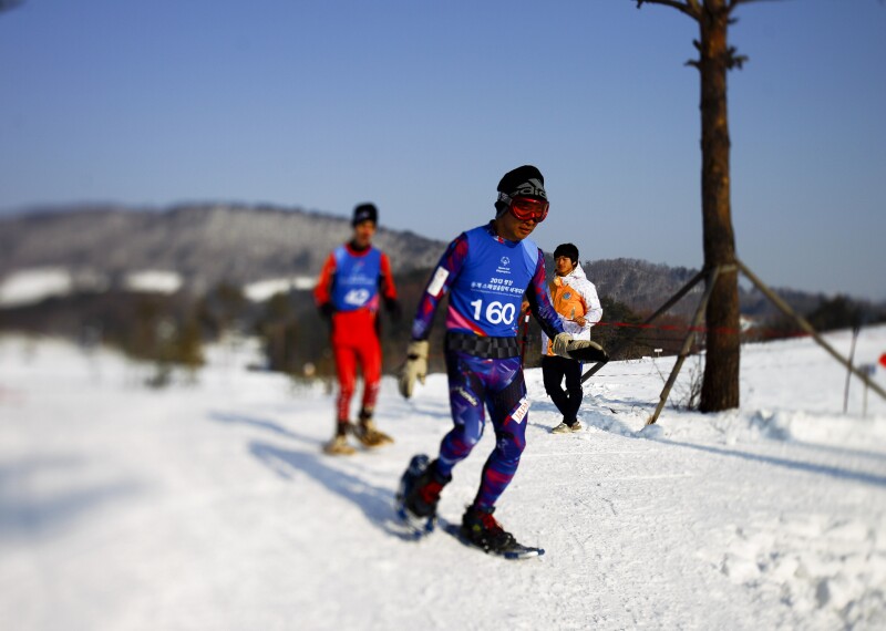 Snowshoe athletes on the snow racing. 