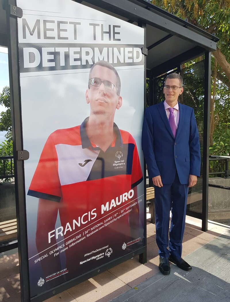 Special Olympics Gibraltar athlete Francis Mauro stands proudly alongside his poster ahead of Special Olympics Gibraltar National Games in September 2019.