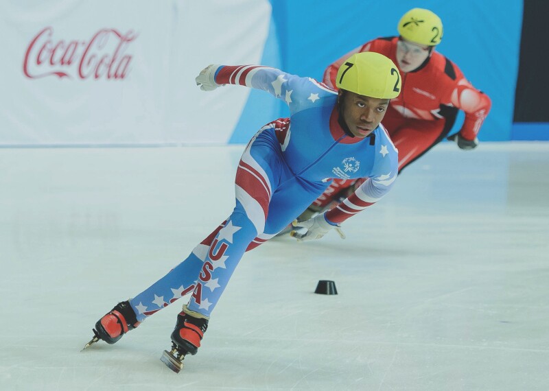 Two athletes racing on a the ice.