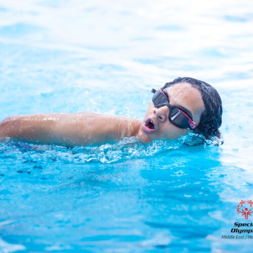 Swimmers swimming in a pool