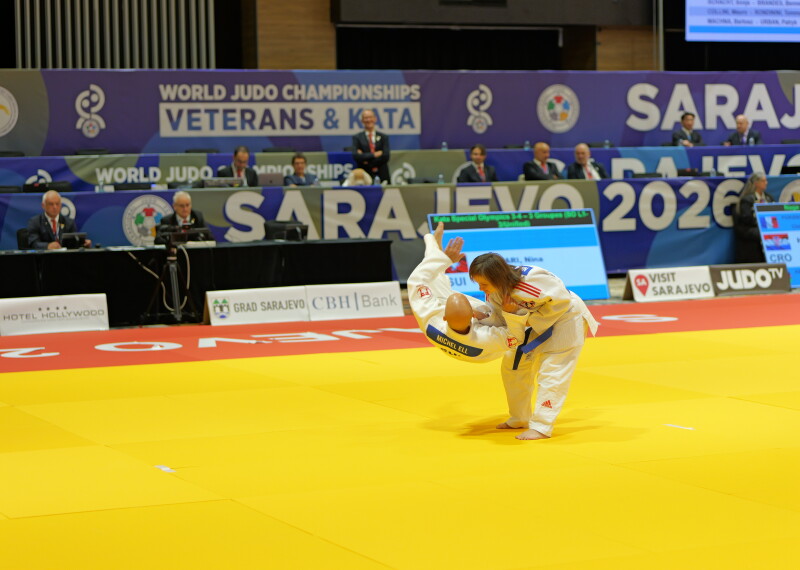 Two judokas performing kata on the tatami 
