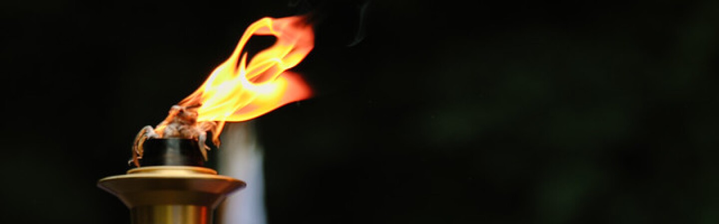 Athlete holding the torch for Torch Run Event