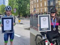 Two athletes showing their awards. 