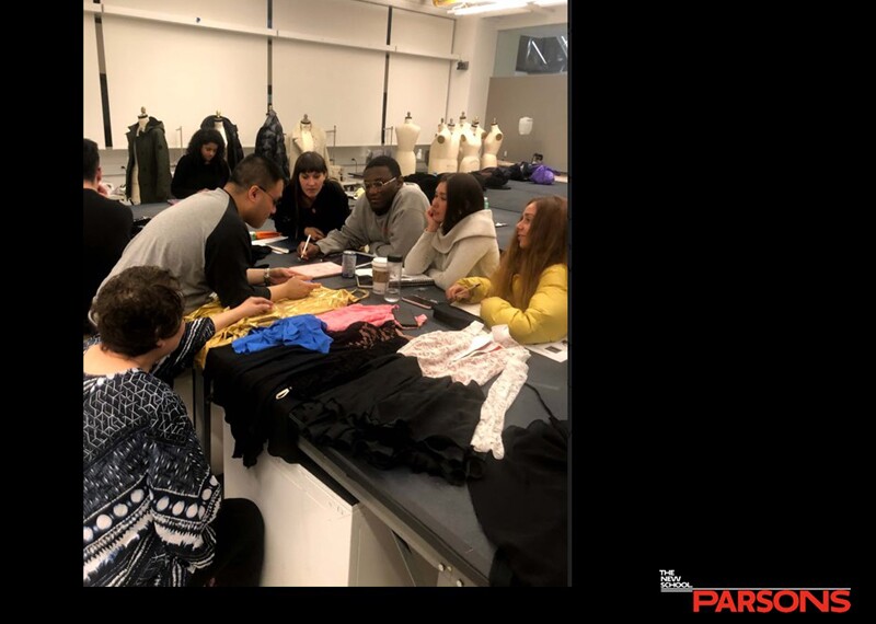 Special Olympics New York and Parsons School of Design students gathered at a work table to create figure skating clothing designs.