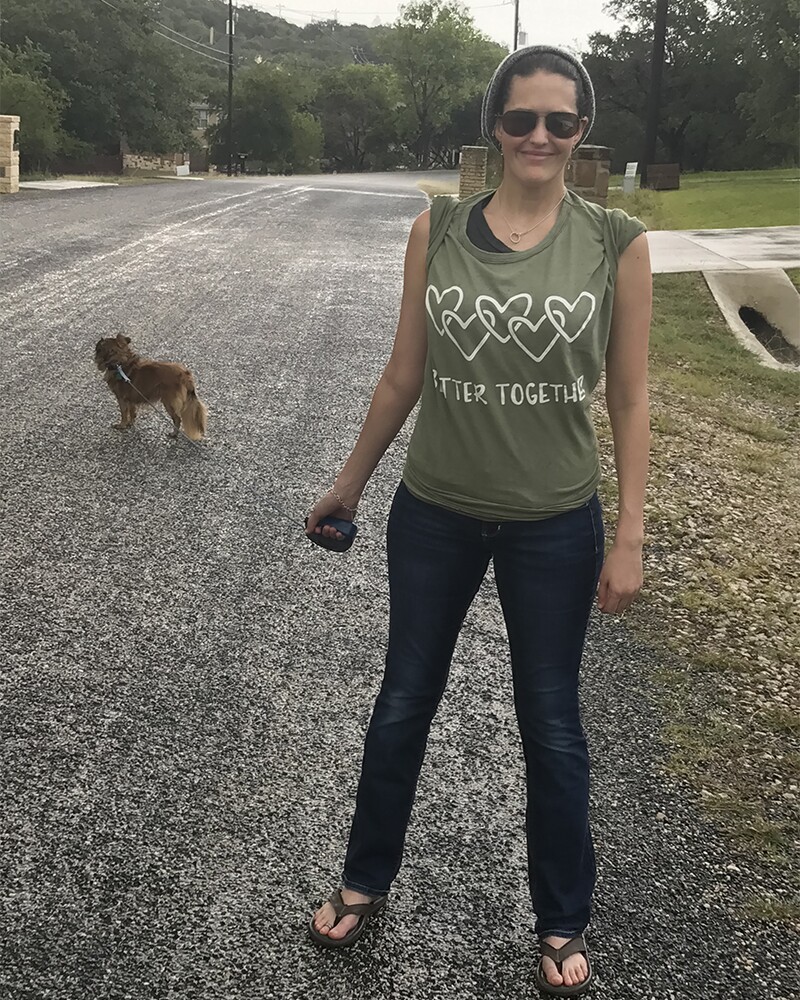 800X1000 - Jamie Holt outside in a green Better Together t-shirt walking her dog.