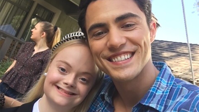 Lily and Darren Barnet standing together for a selfie.